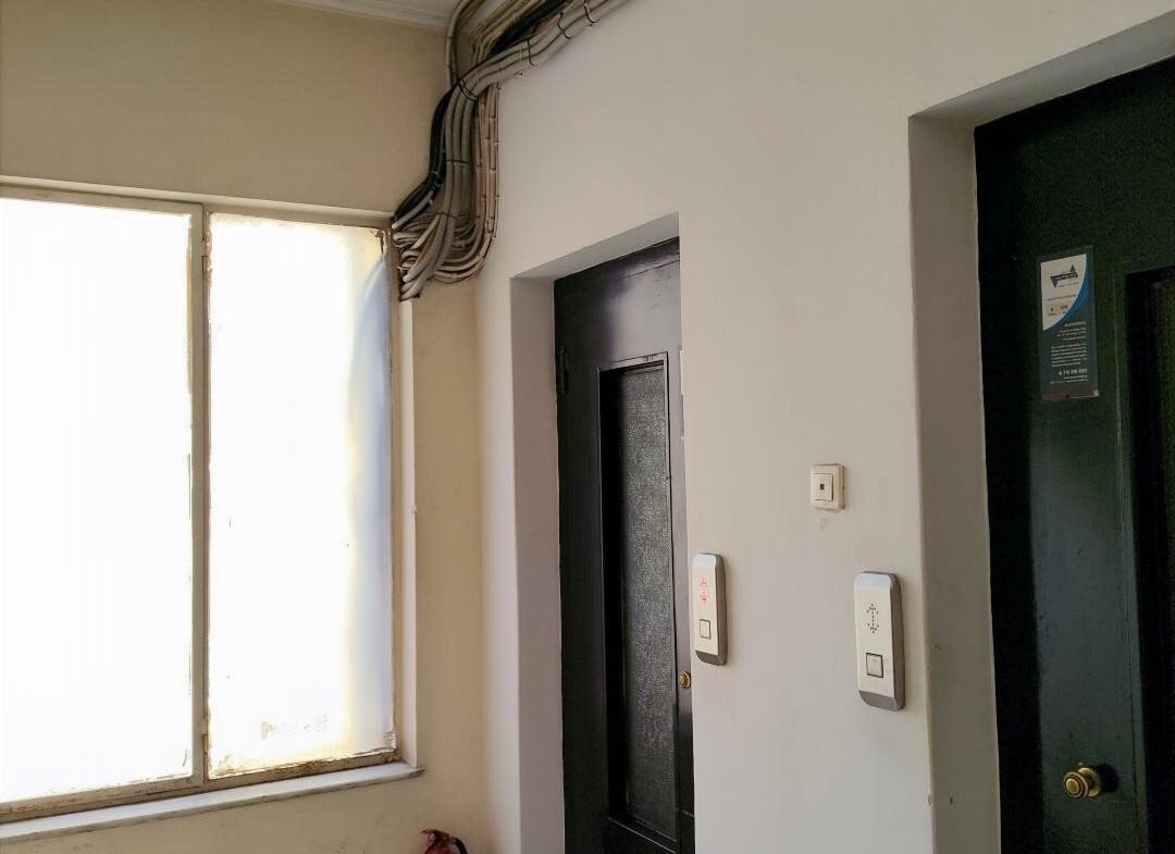 Second-floor elevator lobby in the professional building at 64 Ermou Street, Athens.