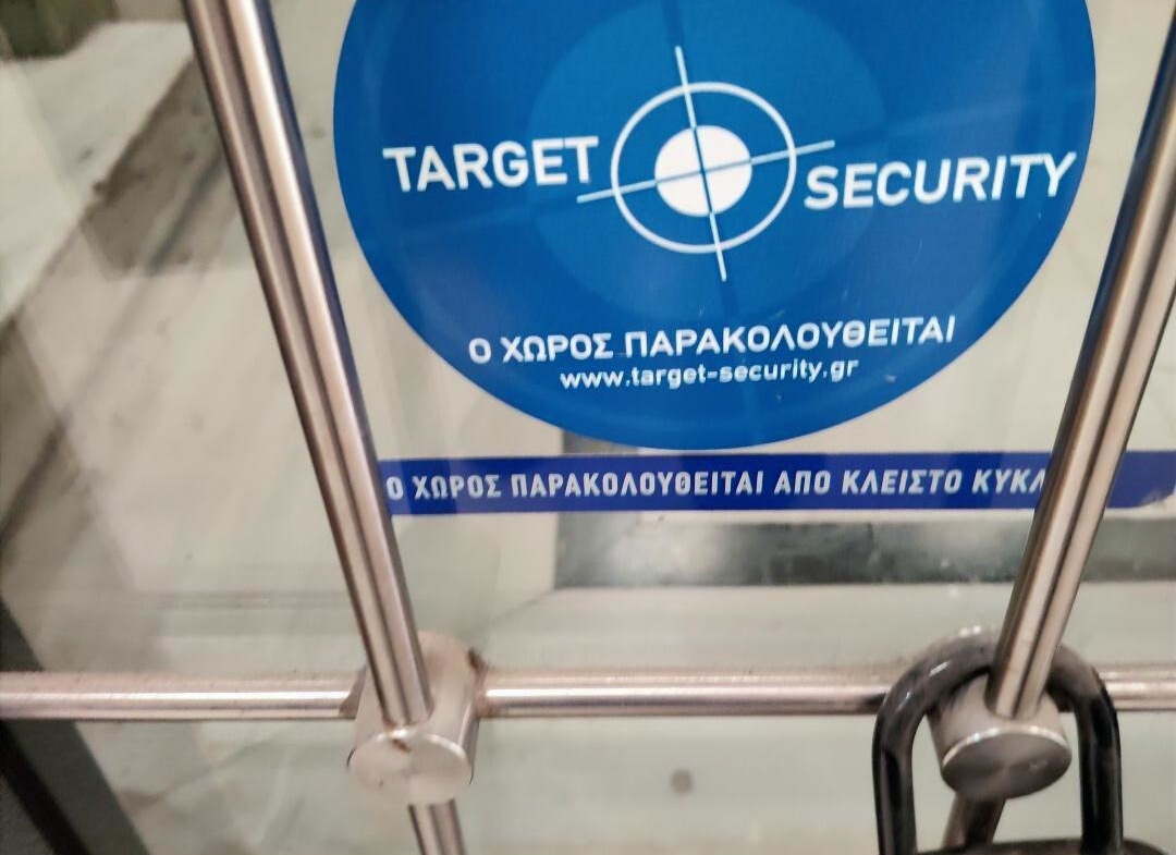 Security surveillance notice at the professional building on Ermou Street, Athens.