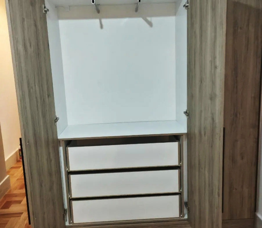 Fitted wardrobe with a hanging rail, shelf and drawers in an apartment in Ano Patisia, Athens