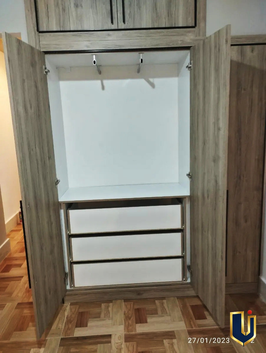 Fitted wardrobe with a hanging rail, shelf and drawers in an apartment in Ano Patisia, Athens