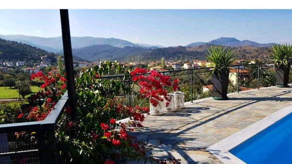 Private swimming pool and stone patio at a villa in Anaxos, Lesvos