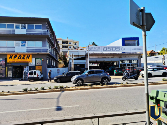 Street-facing commercial property on Tatoiou Avenue in Metamorfosi, photographed from across the road.