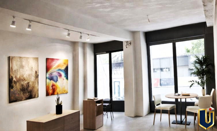 Illustrative image of a bright commercial interior with large windows and an open layout, property 150-1074 in Piraeus