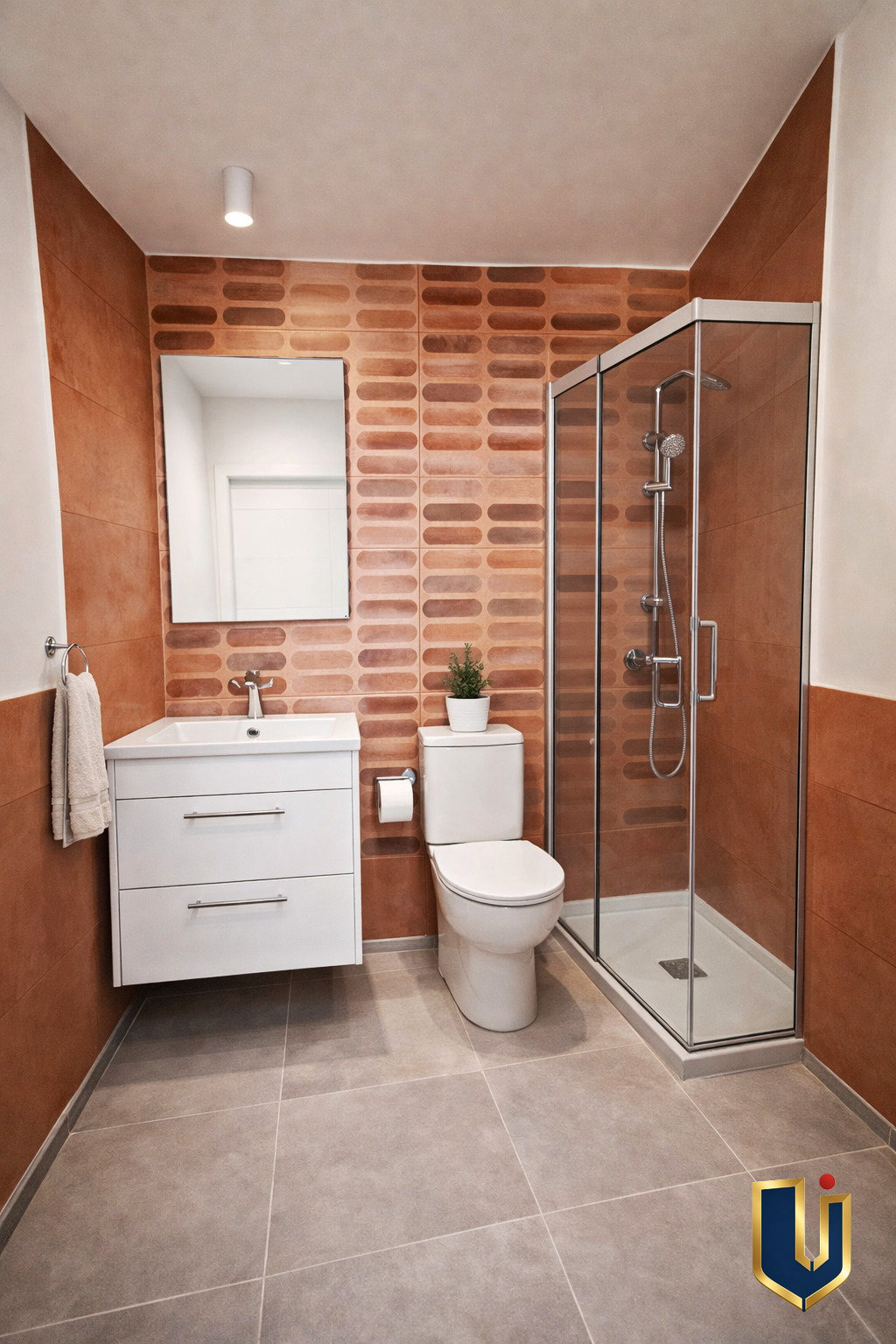 Illustrative bathroom with tiled walls, a sink and a toilet.