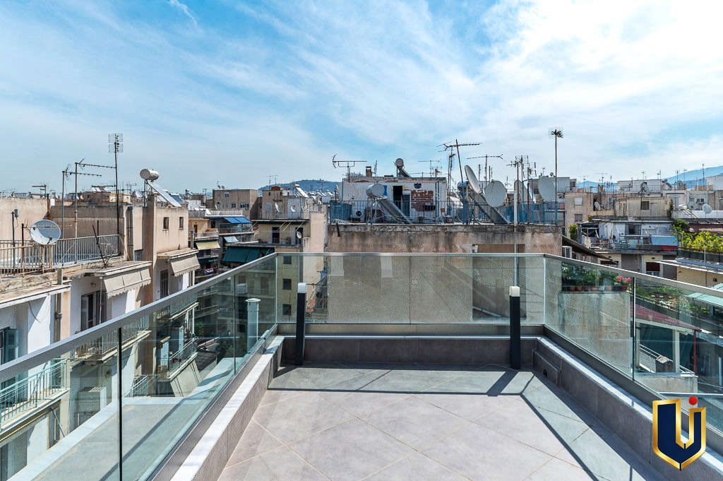 Terrace with glass railings and views across the Athens skyline, property 150-1075.