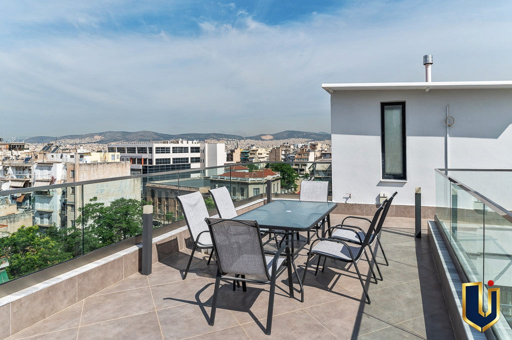 Rooftop terrace with outdoor seating and city views in Athens, property 150-1075.